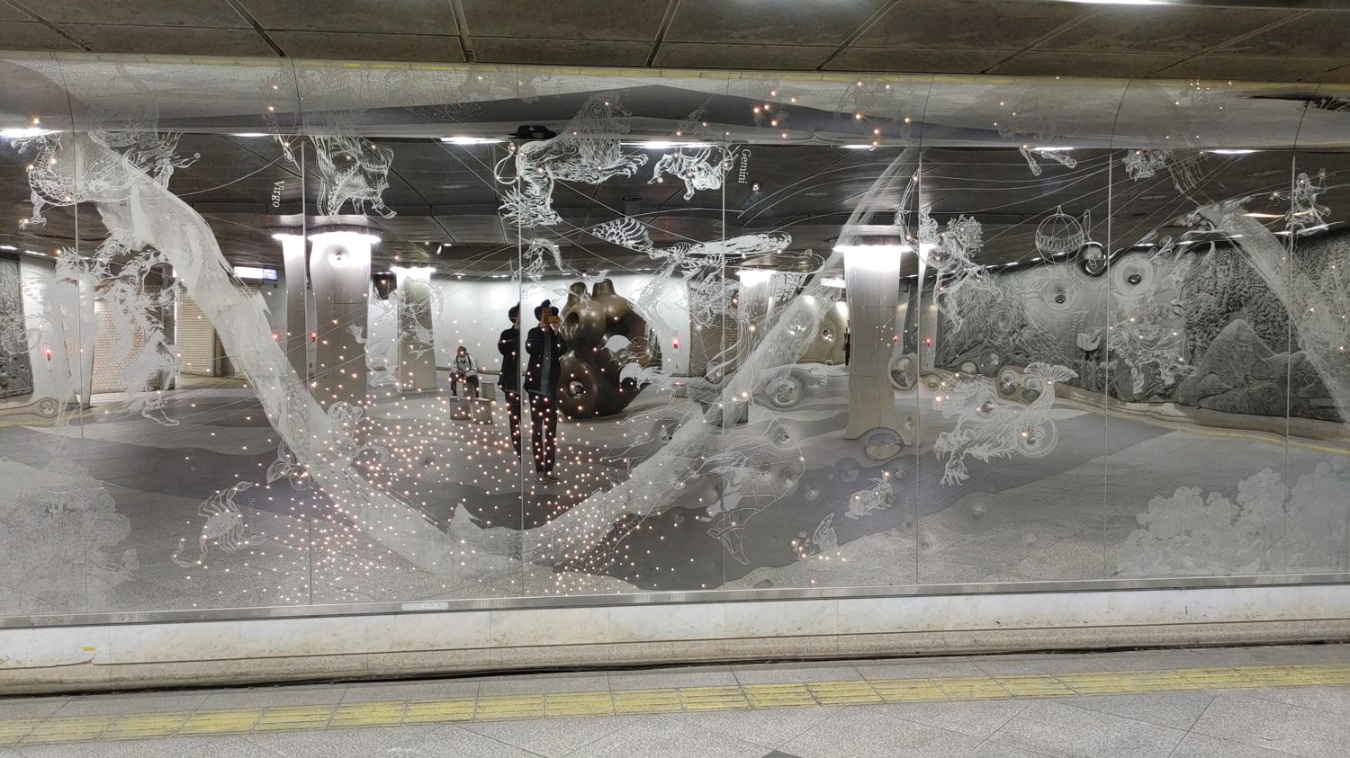 decorative reflective wall with engraved constellation animals