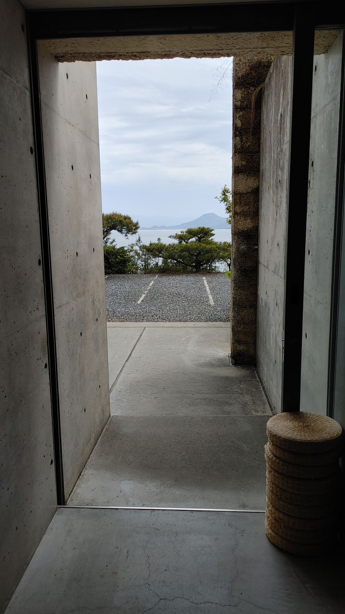 near the cafe, the view through the narrow concrete hallway to the outside