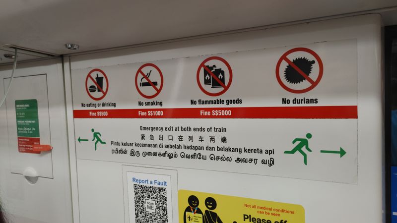 subway sign saying no eating or drinking, no smoking, no flammable goods, and no durians