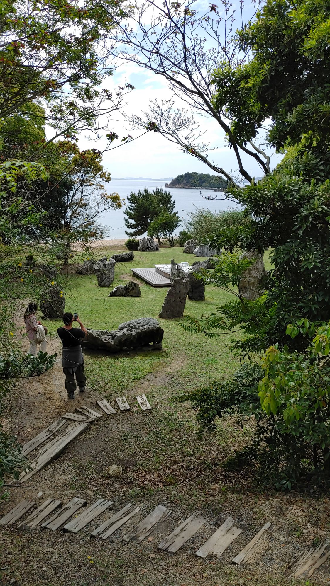 small beachside garden are with stones and arrangements