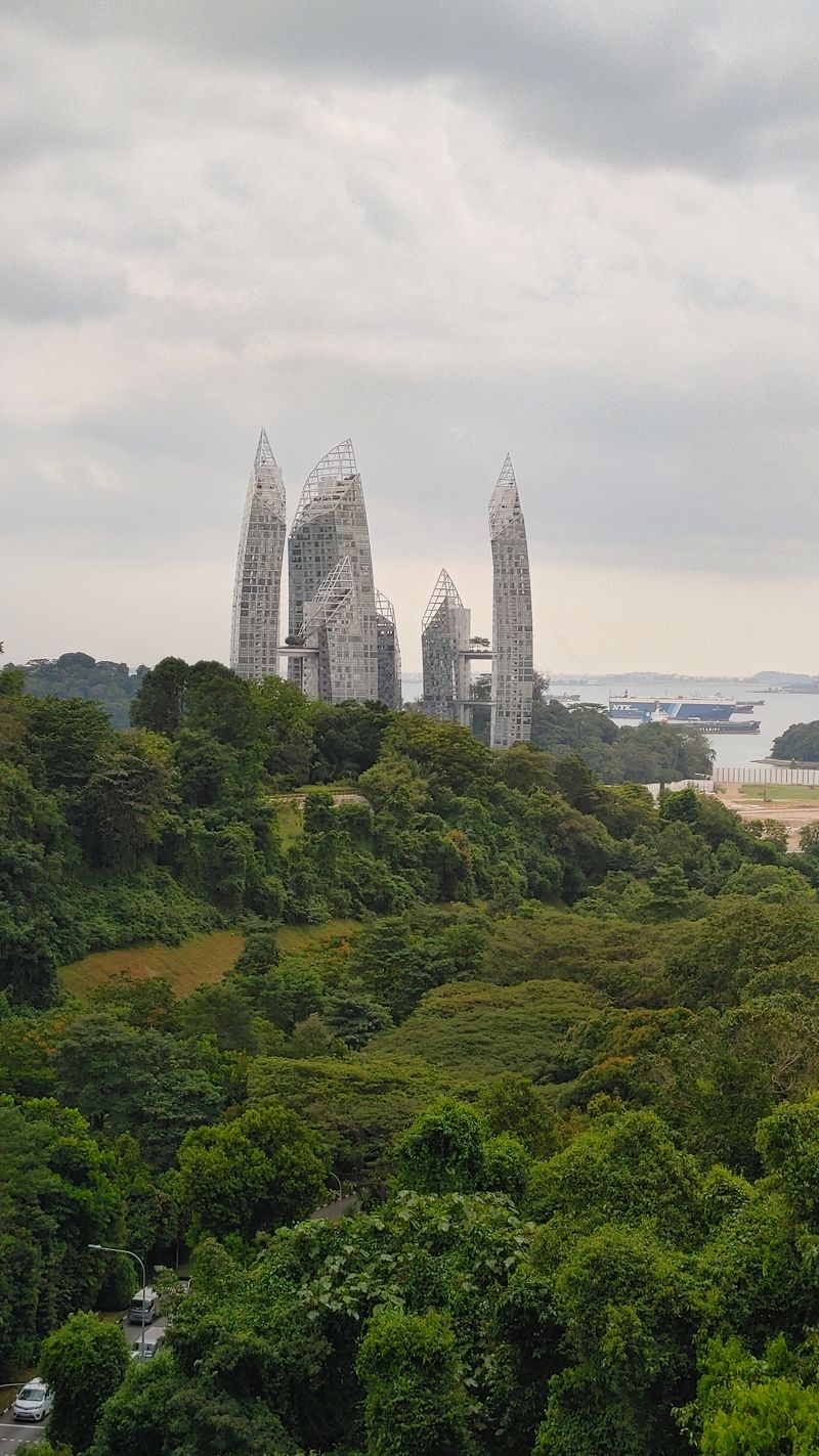 a closer photo of the evil building. There are at least 7 differently sized towers curving toward each other like a claw