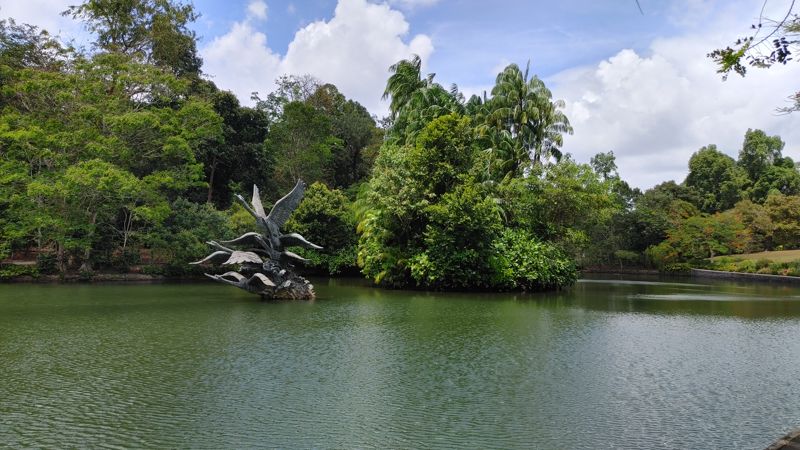 pond with swan sculpture in the middle