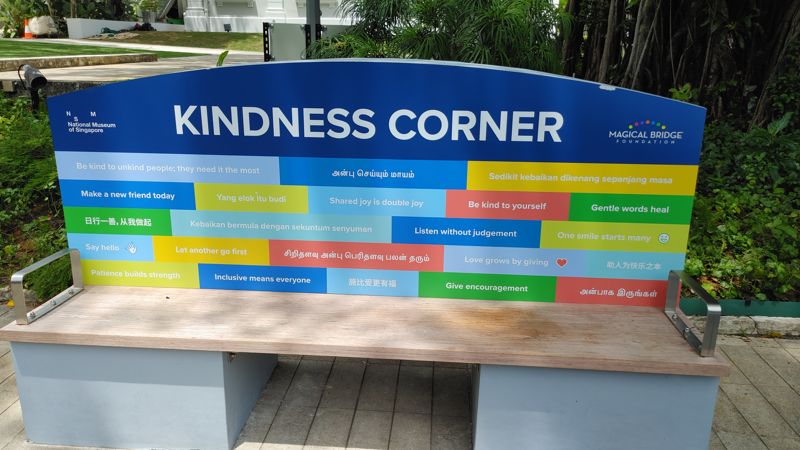 bench with the words Kindness Corner and messages of kindness and generocity